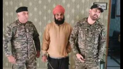 A photo that has gone viral on social media shows 23-year-old Sharandeep Singh in the custody of Pakistan’s security forces. A photo that has gone viral on social media shows 23-year-old Sharandeep Singh in the custody of Pakistan’s security forces.