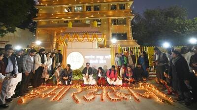 Delhi BJP president Virendra Sachdeva with others while lighting lamps at the Delhi BKJP office on Wednesday. (Sanjeev Verma/Hindustan Times)
