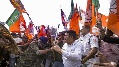Howrah: Security personnel try to stop BJP supporters during a protest against the alleged killing of a Hindu youth in Bangladesh, near Howrah Bridge (PTI)