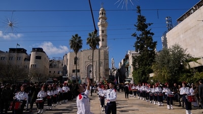 Palestinian scout bands parade at the Manger Square near the Church of the Nativity, traditionally believed to be the birthplace of Jesus, on Christmas Eve, in the West Bank city of Bethlehem. (AP Photo/Nasser Nasser) (AP) Palestinian scout bands parade at the Manger Square near the Church of the Nativity, traditionally believed to be the birthplace of Jesus, on Christmas Eve, in the West Bank city of Bethlehem. (AP Photo/Nasser Nasser) (AP)