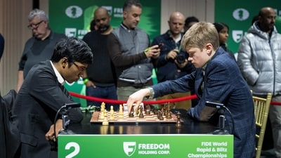 GM Volodar Murzin (R) during a match with R Praggnanandhaa at FIDE World Rapid Chess Championship 2024. (PTI)