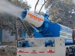 A MCG anti-smog gun spraying water to provide relief from the dust and air pollution in Gurugram. (HT)