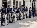 Bangladesh Police personnel stand guard outside the International Crimes Tribunal in Dhaka.