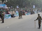 Bangladesh news LIVE: Bangladesh Army soldiers stand guard next to supporters of the Bangladesh Nationalist Party (BNP) for Tarique Rahman's homecoming