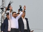 Tarique Rahman, son of former prime minister Khaleda Zia and Bangladesh Nationalist Party (BNP)'s acting chairman waves to supporters after his arrival in Dhaka.