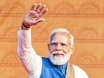 Prime Minister Narendra Modi waves during a public meeting in Lucknow on Thursday. (Naeem Ansari/ANI)