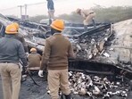 Screengrab of the video showing emergency workers clearing the charred remains of the bus that went up in flames after collision with a lorry on NH-48.