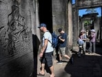 This photo taken on December 18, 2025 shows tourists visiting the Bayon temple in Siem Reap province, Cambodia. This photo taken on December 18, 2025 shows tourists visiting the Bayon temple in Siem Reap province, Cambodia.