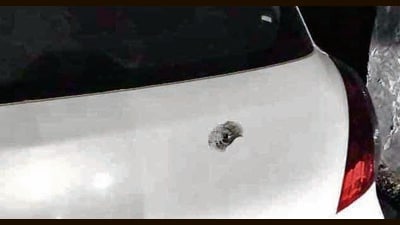 The acting sarpanch’s car with a bullet mark on the boot near Doraha in Ludhiana on Thursday. (HT Photo) The acting sarpanch’s car with a bullet mark on the boot near Doraha in Ludhiana on Thursday. (HT Photo)