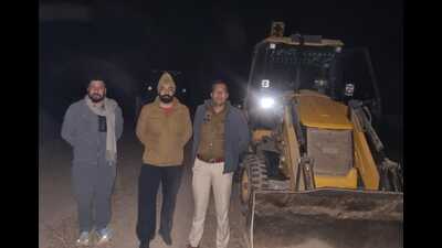 The district police on Thursday caught two JCB machines on shamlat land in Rattewali village. (HT Photo) The district police on Thursday caught two JCB machines on shamlat land in Rattewali village. (HT Photo)