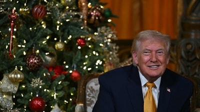 Trump participates in NORAD Santa tracker phone calls, on Christmas Eve, from the Mar-a-lago club in Palm Beach, Florida, on December 24, 2025. (Photo by ANDREW CABALLERO-REYNOLDS / AFP) (AFP) Trump participates in NORAD Santa tracker phone calls, on Christmas Eve, from the Mar-a-lago club in Palm Beach, Florida, on December 24, 2025. (Photo by ANDREW CABALLERO-REYNOLDS / AFP) (AFP)