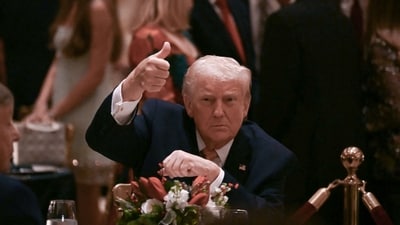US President Donald Trump gives a thumbs up as he attends a Christmas dinner at his Mar-a-Lago resort in Palm Beach, Florida, on December 24, 2025. (Photo by ANDREW CABALLERO-REYNOLDS / AFP) (AFP) US President Donald Trump gives a thumbs up as he attends a Christmas dinner at his Mar-a-Lago resort in Palm Beach, Florida, on December 24, 2025. (Photo by ANDREW CABALLERO-REYNOLDS / AFP) (AFP)