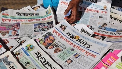 A vendor sells newspapers with headlines about the news of the ousted prime minister Sheikh Hasina in Bangladesh. (REUTERS/File)