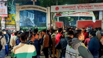 Dhaka: People gather outside the Bangladesh Muktijoddha Sangsad (Freedom Fighters' Parliament) office after a powerful crude bomb explosion rocked the capital on Wednesday (PTI)