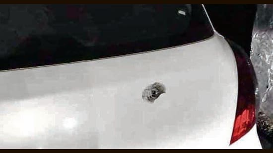 The acting sarpanch’s car with a bullet mark on the boot near Doraha in Ludhiana on Thursday. (HT Photo)