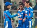Deepti Sharma celebrating a wicket with Jemimah Rodrigues and Harmanpreet Kaur.