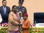 Ten-year-old Shravan Singh of Ferozepur, 17-year-old Vansh Tayal from Chandigarh and Jyoti, 17, hailing from Sirsa district of Haryana were among the group of children from across the nation who were honoured with the Pradhan Mantri Rashtriya Bal Puraskar by President Droupadi Murmu at Vigyan Bhavan in New Delhi on Friday. (HT Photo) Ten-year-old Shravan Singh of Ferozepur, 17-year-old Vansh Tayal from Chandigarh and Jyoti, 17, hailing from Sirsa district of Haryana were among the group of children from across the nation who were honoured with the Pradhan Mantri Rashtriya Bal Puraskar by President Droupadi Murmu at Vigyan Bhavan in New Delhi on Friday. (HT Photo)