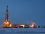 A drilling rig at a natural gas field near Novy Urengoy, Russia. A drilling rig at a natural gas field near Novy Urengoy, Russia.