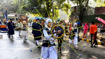 Gram it: Sikh devotees perform Gatka during the Nagar Kirtan procession organised by Delhi Sikh Gurdwara Management Committee (DSGMC), as part of Shri Guru Gobind Singh Ji’s Parkash Purab celebration, at Gurudwara Rakab Ganj Sahib on Thursday (December 25). (Photo: ANI)