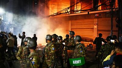 Bangladesh army stands guard at the premises of the Prothom Alo daily newspaper after protesters set it on fire after news reached the country from Singapore of the death of a prominent activist Sharif Osman Hadi on Dec. 19 (AP FILE) Bangladesh army stands guard at the premises of the Prothom Alo daily newspaper after protesters set it on fire after news reached the country from Singapore of the death of a prominent activist Sharif Osman Hadi on Dec. 19 (AP FILE)