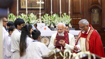 Prime Minister Narendra Modi greets as he arrives during the Christmas morning service at the Cathedral Church of the Redemption, in New Delhi. (@PMOIndia/X) Prime Minister Narendra Modi greets as he arrives during the Christmas morning service at the Cathedral Church of the Redemption, in New Delhi. (@PMOIndia/X)