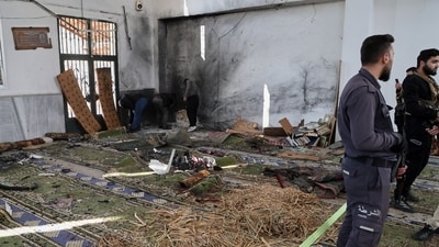 Syrian security forces inspect the damage after an explosion in the Imam Ali bin Abi Talib Mosque in a predominantly Alawite area of the Wadi al-Dhahab neighborhood in Homs, Syria on Friday, December 26, 2025. (AP) Syrian security forces inspect the damage after an explosion in the Imam Ali bin Abi Talib Mosque in a predominantly Alawite area of the Wadi al-Dhahab neighborhood in Homs, Syria on Friday, December 26, 2025. (AP)