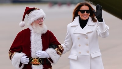 First lady Melania Trump arrives with Santa for a Toys for Tots charity drive event at Marine Corps Base Quantico, Monday, Dec. 8, 2025, in Quantico, (AP) First lady Melania Trump arrives with Santa for a Toys for Tots charity drive event at Marine Corps Base Quantico, Monday, Dec. 8, 2025, in Quantico, (AP)