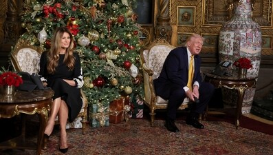 U.S. President Donald Trump and first lady Melania Trump participate in NORAD Santa tracker phone calls, on Christmas Eve, from the Mar-a-lago club in Palm Beach, Florida, U.S., December 24, 2025. (REUTERS)