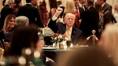 Donald Trump, Melania Trump and Viktor Knavs, Melania Trump's father, at the Christmas Eve dinner at the Mar-a-Lago club in Palm Beach, Florida, December 24, 2025. REUTERS/Jessica Koscielniak (REUTERS)