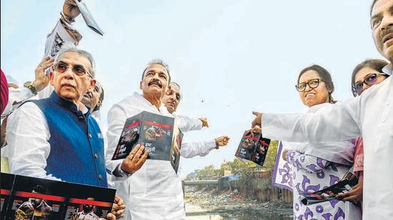 iMumbai, India - December 26, 2025: Ahead of the Brihanmumbai Municipal Corporation (BMC) elections, Mumbai Congress president and MP Varsha Gaikwad, along with party leaders, releases a chargesheet against the ruling party while showing garbage-choked Mithi River during a live demonstration at Bharat Nagar near BKC in Mumbai, India, on Friday, December 26, 2025. (Photo by Satish Bate/ Hindustan Times) (Hindustan Times)