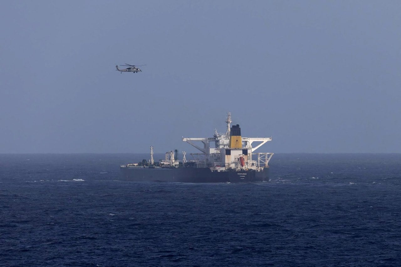 A U.S. military helicopter flies over the Centuries oil tanker, which was intercepted by the U.S. Coast Guard. A U.S. military helicopter flies over the Centuries oil tanker, which was intercepted by the U.S. Coast Guard.