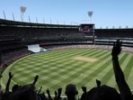 Fans cheer as England's Ben Duckett is dismissed during the second day of the fourth Ashes cricket Test match between Australia and England at the Melbourne Cricket Ground (MCG) in Melbourne on December 27, 2025. (Photo by Martin KEEP / AFP) / -- IMAGE RESTRICTED TO EDITORIAL USE - STRICTLY NO COMMERCIAL USE --
