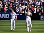 Ben Stokes and Joe Root applaud the crowd at the MCG after England win their first Test in Australia since 2011.