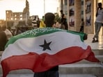 A man holds a flag of Somaliland in front of the Hargeisa War Memorial monument in Hargeisa on November 7, 2024. Somaliland's president on December 26, 2025 welcomed Israel's announcement that it was recognising its statehood and said the decision marked the beginning of a "strategic partnership". A man holds a flag of Somaliland in front of the Hargeisa War Memorial monument in Hargeisa on November 7, 2024. Somaliland's president on December 26, 2025 welcomed Israel's announcement that it was recognising its statehood and said the decision marked the beginning of a "strategic partnership".