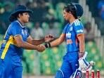 India's captain Harmanpreet Kaur, right, being congratulated by her Sri Lankan counterpart Chamari Athapaththu. India's captain Harmanpreet Kaur, right, being congratulated by her Sri Lankan counterpart Chamari Athapaththu.