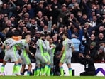 Manchester City's Rayan Cherki celebrates scoring their second goal with teammates.