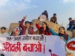 Students display banners during a protest for protection of the Aravalli Hills at Jawaharlal Nehru University on Saturday. (PTI) Students display banners during a protest for protection of the Aravalli Hills at Jawaharlal Nehru University on Saturday. (PTI)
