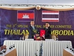 Cambodia's Defence Minister Tea Seiha and Thailand's Defence Minister Natthaphon Narkphanit pose with documents during a special General Border Committee (GBC) meeting at a border checkpoint, in Chanthaburi province, Thailand on December 27, 2025.