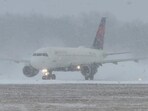 A Delta Air Lines plane prepares to take off during a winter storm at Greater Rochester International Airport in Rochester, New York, U.S.