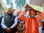 Uttar Pradesh chief minister Yogi Adityanath carries the Guru Granth Sahib on his head on the occasion of Veer Bal Diwas, in Lucknow on Friday. (ANI PHOTO) Uttar Pradesh chief minister Yogi Adityanath carries the Guru Granth Sahib on his head on the occasion of Veer Bal Diwas, in Lucknow on Friday. (ANI PHOTO)