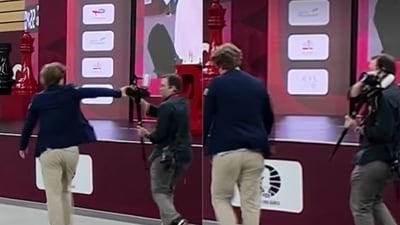 Magnus Carlsen pushes a camera away after his defeat. (X) Magnus Carlsen pushes a camera away after his defeat. (X)