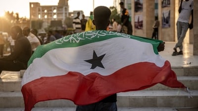 A man holds a flag of Somaliland in front of the Hargeisa War Memorial monument in Hargeisa on November 7, 2024. Somaliland's president on December 26, 2025 welcomed Israel's announcement that it was recognising its statehood and said the decision marked the beginning of a "strategic partnership". (AFP) A man holds a flag of Somaliland in front of the Hargeisa War Memorial monument in Hargeisa on November 7, 2024. Somaliland's president on December 26, 2025 welcomed Israel's announcement that it was recognising its statehood and said the decision marked the beginning of a "strategic partnership". (AFP)