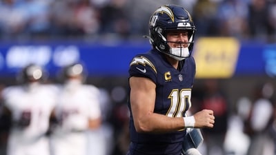 Justin Herbert #10 of the Los Angeles Chargers reacts after being sacked by the Houston Texans (Getty Images via AFP) Justin Herbert #10 of the Los Angeles Chargers reacts after being sacked by the Houston Texans (Getty Images via AFP)