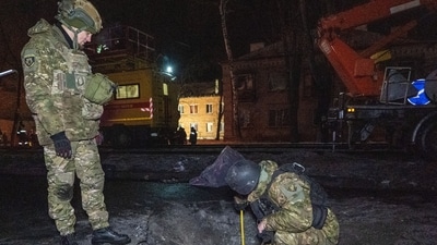 Police officers inspect the site of the Russian airstrike in Ukraine. (AP/ Representative) Police officers inspect the site of the Russian airstrike in Ukraine. (AP/ Representative)