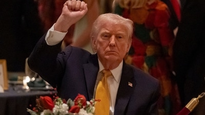 President Donald Trump pumps his fist at Christmas Eve dinner at his Mar-a-Lago club, Wednesday, Dec. 24, 2025, in Palm Beach, Florida. (AP) President Donald Trump pumps his fist at Christmas Eve dinner at his Mar-a-Lago club, Wednesday, Dec. 24, 2025, in Palm Beach, Florida. (AP)
