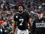 Las Vegas Raiders quarterback Geno Smith (7) grimaces as he leaves the field during the second half vs New York Giants
