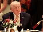 Donald Trump takes part in a Christmas Eve dinner in the ballroom of his Mar-a-Lago club in Palm Beach, Florida, US