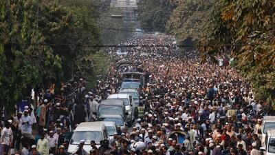 A convoy carrying the body of Sharif Osman Hadi, a student leader, who died after being shot in the head, moves along the crowd after the funeral prayer in Dhaka. (Reuters) A convoy carrying the body of Sharif Osman Hadi, a student leader, who died after being shot in the head, moves along the crowd after the funeral prayer in Dhaka. (Reuters)