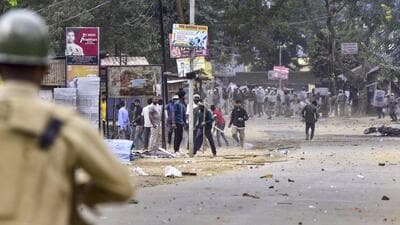 People pelt stones during a clash between two groups over the issue of eviction at Kheroni in West Karbi Anglong district of Assam on December 23. (PTI)