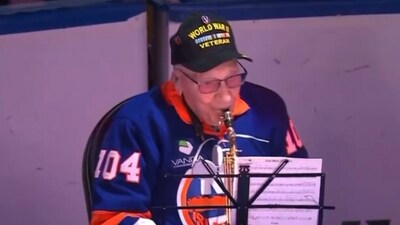 Dominick Critelli, 104-year-old WWII veteran, plays US national anthem at Rangers-Islanders game (X) Dominick Critelli, 104-year-old WWII veteran, plays US national anthem at Rangers-Islanders game (X)
